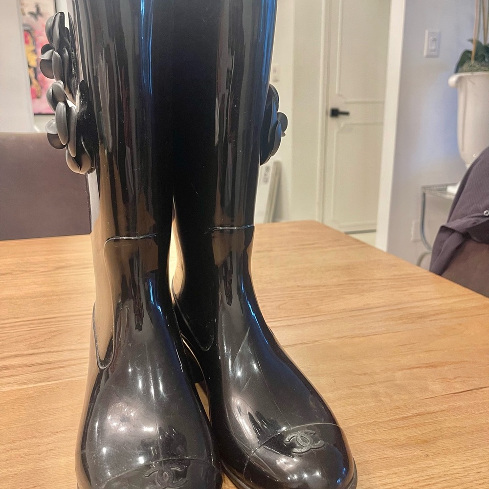 CHANEL Glossy Black Boots with Floral Accents